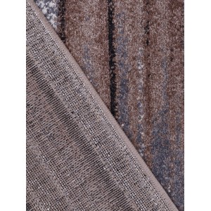 Zbliżenie dywanu z krótkim włosiem t.b.t. z brązowymi i niebieskimi wzorami.