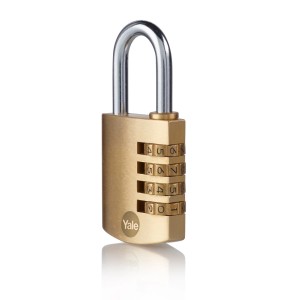 Mosiężny zamek szyfrowy Yale z czterema pierścieniami numerycznymi i srebrnym pałąkiem.