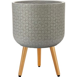 Szara doniczka t.b.t. ze wzorem i drewnianymi nóżkami.