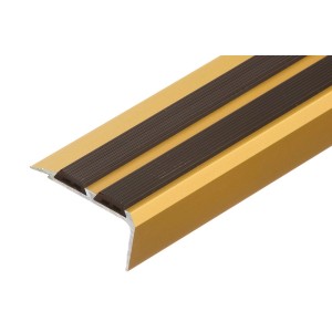 Złoty profil krawędzi schodów z dwoma czarnymi paskami antypoślizgowymi.