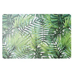 Obrus z motywem tropikalnych liści, idealny na stół w jadalni.