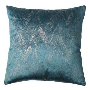 Dekoracyjna poduszka t.b.t. z zygzakowatym wzorem w kolorze turkusowym i srebrnym.