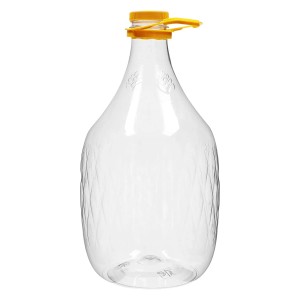 Przezroczysty balon z żółtym korkiem do wina i moszczu.