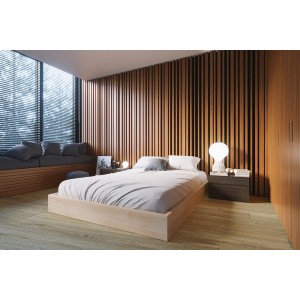 Sypialnia z jasną drewnianą podłogą i łóżkiem. Podłoga PCV imituje drewno.