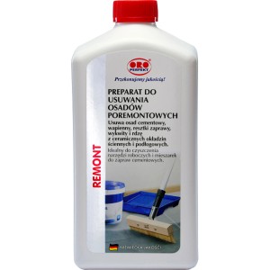 Środek do usuwania zabrudzeń pobudowlanych w białej butelce z czerwoną nakrętką.