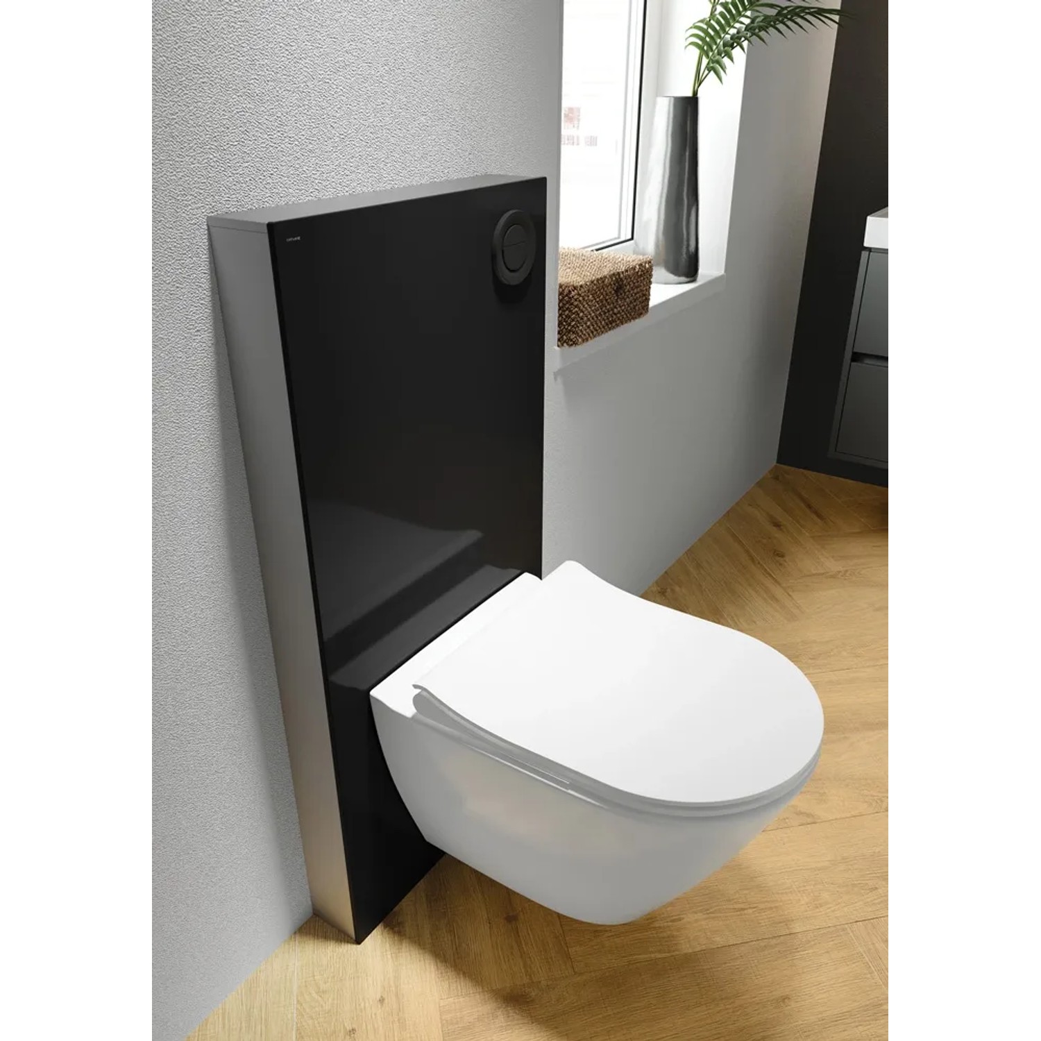 Zestaw WC wiszącego ze spłuczką w kolorze czarnym i białą ceramiką do nowoczesnych łazienek.