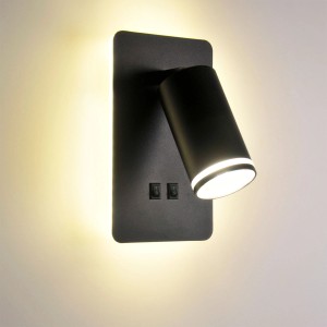 Czarna lampa ścienna t.b.t. (Kinkiet) z cylindrycznym, regulowanym reflektorem.