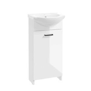 Biała szafka pod umywalkę z zestawu mebli łazienkowych t.b.t. z czarnym uchwytem.