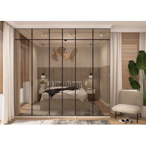 Nowoczesna szafa t.b.t. z czarnymi ramami i lustrzanymi drzwiami w sypialni.