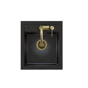 Czarny zlewozmywak granitowy t.b.t. ze złotą baterią, widok z góry.