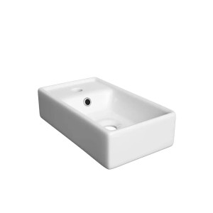 Prostokątna umywalka nablatowa t.b.t. ceramiczna w kolorze białym.