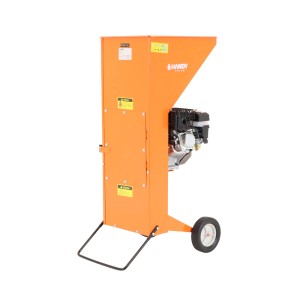 Pomarańczowy rozdrabniacz t.b.t. z silnikiem i kołami dla łatwego transportu.