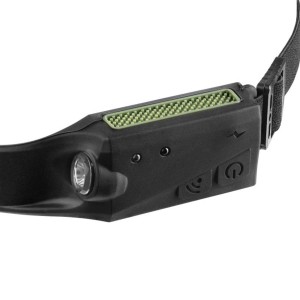 Czarna latarka czołowa t.b.t. z zielonymi akcentami i regulowanym paskiem.