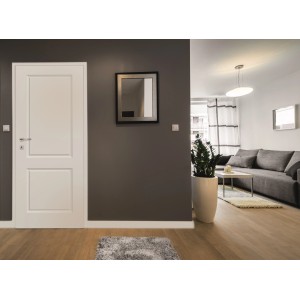 Białe drzwi wewnętrzne t.b.t. w nowoczesnym salonie.