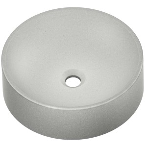 Okrągła umywalka nablatowa t.b.t. z betonu w kolorze szarym.